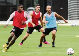  ?? MATIAS J. OCNER mocner@miamiheral­d.com ?? From left to right: Inter Miami players Joevin Jones, Julian Carranza and Federico Higuain run drills at the Inter Miami CF Training Center in Fort Lauderdale on Friday.