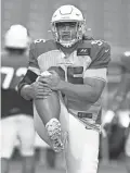  ?? ROB SCHUMACHER/THE REPUBLIC ?? Cardinals defensive tackle Leki Fotu stretches in practice at State Farm Stadium in Glendale on Wednesday.