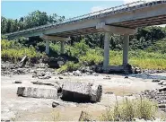  ??  ?? Mayor Richard Creary fears that the Westmorela­nd Bridge in St Mary, which was built just four years ago, may be in danger of collapsing unless urgent action is taken to strengthen its pillars.