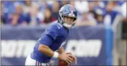  ?? ADAM HUNGER — THE ASSOCIATED PRESS ?? New York Giants quarterbac­k Daniel Jones (8) rolls out of the pocket against the Minnesota Vikings on Sunday.