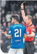  ??  ?? Willie Collum shows Daniel Candeias the red card