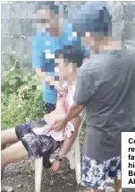  ?? ?? Concerned neighbors restrain a disoriente­d father after killing his son in Barangay Bubog, Numancia, Aklan.