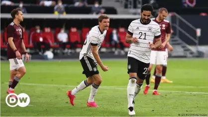  ??  ?? Gündogan celebrates his fine goal for Germany, their second of the night.