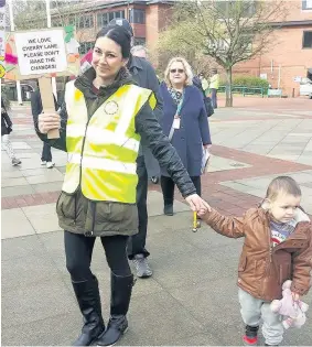  ??  ?? Campaigner­s held placards and chanted outside Hillingdon Council offices