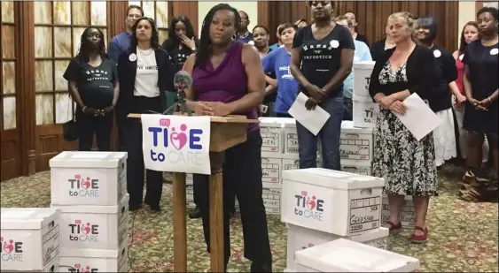  ??  ?? In this May 29 file photo, Danielle Atkinson, a member of the Michigan Time to Care group that submitted signatures for a ballot initiative to mandate earned paid sick time, speaks in support of the measure at the Central United Methodist Church in Lansing, Mich. AP PHOTO/ALICE YIN