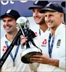  ??  ?? WINNING SMILES: Root (right), Stuart Broad (centre) and James Anderson