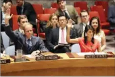  ?? MARY ALTAFFER - THE ASSOCIATED PRESS ?? British Ambassador to the United Nations Matthew Rycroft, left, and U.S. Ambassador to the United Nations Nikki Haley vote during a Security Council meeting on a new sanctions resolution that would increase economic pressure on North Korea to return to...