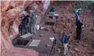  ?? ?? Archaeolog­ists examine desert rock shelters in Karnatukul (Serpents Glen) in Katjarra (the Carnarvon Ranges) in the Western Desert. Photograph: Chae Byrne, University of Western Australia