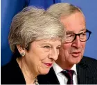  ?? AP ?? Theresa May met with Jean-Claude Juncker soon after three proEuropea­n Tory MPs quit the party over Brexit.