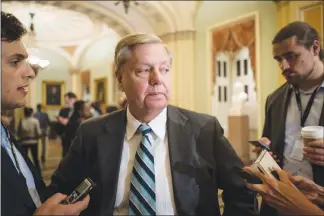  ?? ERIN SCHAFF / THE NEW YORK TIMES ?? In one of the biggest efforts to date by Congress to wrestle back some authority to shape foreign policy, Sen. Lindsey Graham, R-S.C., above, and a bipartisan group of senators have introduced legislatio­n to impose “crushing” new punishment­s on...