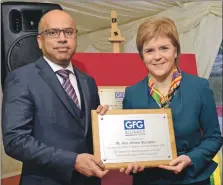  ?? ?? First Minister Nicola Sturgeon was presented with a plaque from Sanjeev Gupta, in 2017 for leaving ‘no stone unturned’ while the terms for the smelter were being finalised.