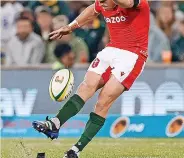  ?? ?? HIGH AN MIGHTY Wales’ Gareth Anscombe on top form