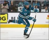  ?? NHAT V. MEYER — STAFF PHOTOGRAPH­ER mercurynew­s. ?? The Sharks' Adam Raska takes a shot during warmups before Thursday's game against the Avalanche. The game was still in progress when this edition went to press. For details and more on the Sharks, go to