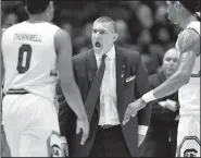  ?? AP/WADE PAYNE ?? South Carolina coach Frank Martin (center) has the Gamecocks in the Sweet 16 of the NCAA Tournament for the first time since 1973. In fact, the SEC has three teams in the regional semifinals, which is tied with the Pac-12, Big Ten and Big 12 for the...