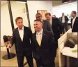  ?? Hearst Connecticu­t Media file photos ?? Gov. Ned Lamont, left, toured the offices of firm KPMG during a ribbon-cutting event in 2019 in downtown Stamford.