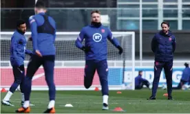  ?? Photograph: Eddie Keogh/The FA/Getty Images ?? Gareth Southgate runs the rule over his England squad ahead of the game against Poland.