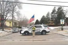  ?? RJ Sangosti, The Denver Post ?? Thornton resident Michael Kapaun displays an American flag Thursday in support of Adams County Sheriff ’s Deputy Heath Gumm, who was killed Wednesday.