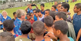  ?? Photo: FASANOC ?? Internatio­nal Olympic Committee president Thomas Bach speaks with junior rugby players at Albert Park Suva on May 4, 2022.