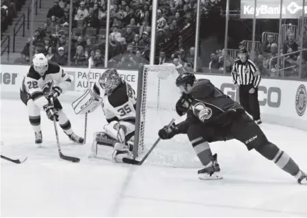  ??  ?? Avalanche forward Jack Skille goes with a wraparound shot while trying to score against Devils goaltender Cory Schneider during the third period of Thursday night’s game at the Pepsi Center. Schneider finished with 23 saves. Andy Cross, The Denver Post