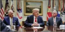  ?? THE ASSOCIATED PRESS ?? President Donald Trump, flanked by Independen­ce Blue Cross CEO Daniel J. Hilferty, left, and Blue Cross and Blue Shield of North Carolina CEO Brad Wilson, speaks during a meeting with health insurance company executives in the Roosevelt Room of the...