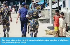  ?? — AFP ?? This photo taken on July 18, 2018 shows Bangladesh­i police patrolling in a Rohingya refugee camp in Teknaf.