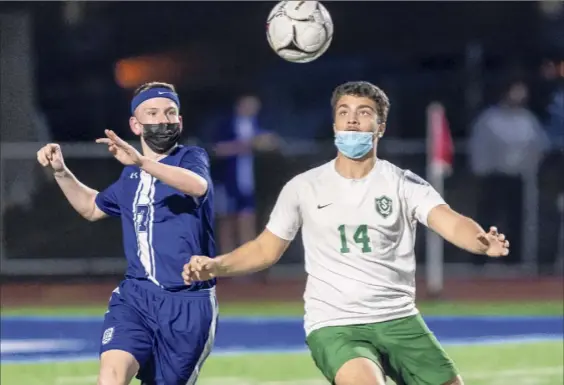  ?? Photos by James Franco / Special to the Times Union ?? La Salle sophomore Dylan Sutton and Schalmont junior Salmaan Haider keep their eyes on the ball during a Colonial Council game at La Salle Institute in Troy on Thursday. The teams battled to a draw after regulation and two 10-minute overtime sessions.