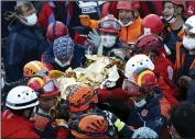  ?? (AP/Istanbul Fire Authority) ?? Rescuers carry 3-year-old Elif Perincek from the rubble of a building Monday in Izmir, Turkey.