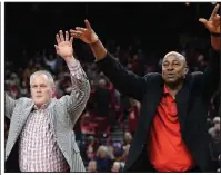  ?? NWA Democrat-Gazette/ANDY SHUPE Arkansas Athletic Director Hunter Yurachek (left) and former Razorback Sidney Moncrief call the Hogs on Saturday after Moncrief was honored for his recent induction into the National Collegiate Basketball Hall of Fame. ??