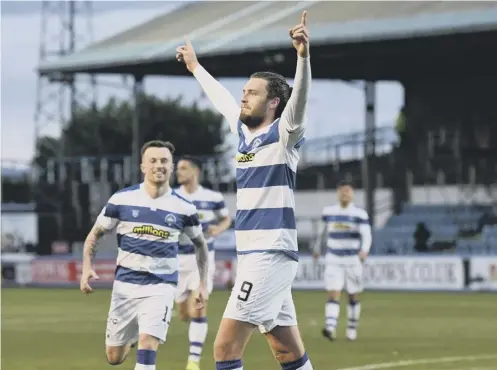  ??  ?? 0 Robbie Muirhea d celebrates after scoring his second goal to seal Morton’s 3-0 victory in the Championsh­ip play-off final second leg