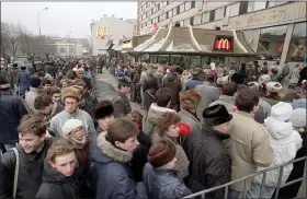  ?? THE ASSOCIATED PRESS ?? Hundreds of Muscovites line up outside the first McDonald’s restaurant in the Soviet Union on its opening day Jan. 31, 1990 in Moscow. Two months after the Berlin Wall fell, another powerful symbol opened its doors in the middle of Moscow: a gleaming new McDonald’s. It was the first American fast-food restaurant to enter the Soviet Union.