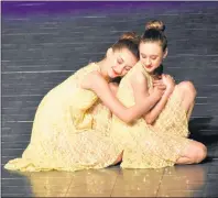  ?? NIKKI SULLIVAN/CAPE BRETON POST ?? Hannah Sears, left, and Jessica Dorko nail a picture-perfect moment during their large group lyrical performanc­e ages 11-12, called Beautiful Thing. The dancers from Lucy Wintermans School of Dance received gold for the performanc­e.