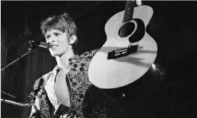  ?? Photograph: Michael Putland/ Getty Images ?? David Bowie’s famous Ziggy outfit in 1972 was made from Liberty design director Bernard Nevill’s fabric Corbusier, named after the modernist architect.