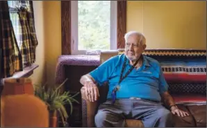  ??  ?? Walter Wilkins, 86, sits on the couch May 27 in his son’s home in Akron, N.Y.