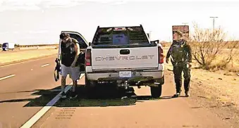  ?? SOURCE: NEW MEXICO STATE POLICE ?? This screenshot from a State Police dash cam video shows Omar Cueva carrying a rifle moments before shooting State Police Officer Darian Jarrott on Feb. 4.