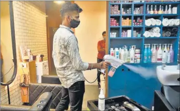  ?? SATISH BATE/HT PHOTO ?? A worker sanitises a salon at Dadar, on Sunday.