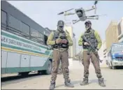  ?? PTI ?? A special police team carries out a search operation at the Jammu bus stand with the help of a drone on Monday.
