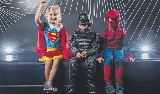  ?? Picture: JERAD WILLIAMS ?? Supergirl Blair Funnell, 3, Batman Max Ede, 3, and Spiderman Matthew Hay, 3, posing at Event Cinemas at Pacific Fair.