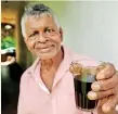  ??  ?? Cheers: Piyasena with a herbal drink mostly of Adathoda