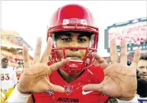  ?? CHRISTIAN PETERSEN / GETTY IMAGES ?? Quarterbac­k Anu Solomon will have a big hand, or two, in the Wildcats’ fortunes in 2015. Solomon passed for 3,793 yards last season as Arizona claimed the Pac-12 South.By Dan Bickley
