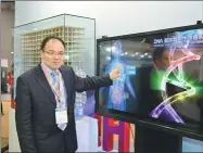  ?? PROVIDED TO CHINA DAILY ?? Lou Jingwei, president of Biotecan Biomedical Technology, demonstrat­es his company’s medical big data system at an exhibition in Shanghai.