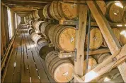  ??  ?? Whiskey is stored in Barrel House 1-14 at the Jack Daniel Distillery in Lynchburg.