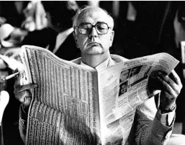  ?? JAMES K. W. ATHERTON/THE WASHINGTON POST ?? Then-Federal Reserve Chairman Paul Volcker reads as he waits for a hearing in 1980.