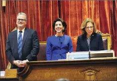  ?? Photo by Ernest A. Brown ?? Governor Gina Raimondo, center and House Speaker Nicholas Mattiello, left, acknowledg­e applause as they are introduced by Senate President M.Teresa Paiva Weed before giving the governor’s State of the State address before a joint session of the Genral...