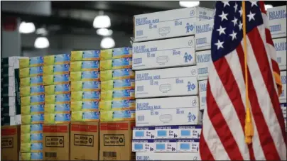  ?? The Associated Press ?? MEDICAL SUPPLIES: Stacks of medical supplies are housed on March 24 at the Jacob Javits Center that will become a temporary hospital in response to the COVID-19 outbreak in New York. A review of federal purchasing contracts by The Associated Press shows federal agencies waited until mid-March to begin placing bulk orders of N95 respirator masks, mechanical ventilator­s and other equipment needed by front-line health care workers.