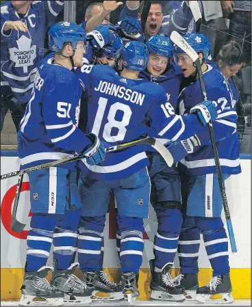  ?? CLAUS ANDERSEN/GETTY IMAGES ?? Toronto players celebrate a goal against the Boston Bruins during Game 6 on Monday night. The Leafs will be hoping to celebrate again when the final buzzer sounds on Game 7 tonight.