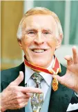  ?? — Reuters file photos ?? Forsyth (above) poses after being knighted by Queen Elizabeth at Buckingham Palace, in central London on Oct 12, 2011. (Right) Forsyth and his wife Wilnelia Merced arrive for Ladies Day at Royal Ascot in southern England on June 16, 2011.