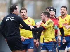  ??  ?? Vlad Iordachesc­u is pursued by Spain players after their defeat by Belgium (Getty)