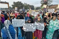  ?? PTI ?? Patus cresu con Etri pulegil h cerum hili ponfeni hiliis, me cotistra vis senimpl. — AFP Members of Indian Muslim Women Solidarity Forum during a protest against the triple talaq bill, in Kolkata. —