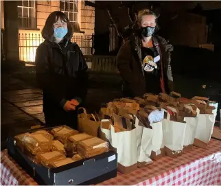  ??  ?? Every Wednesday night outside Nexus Methodist Church in London Road in Bath, volunteers make a hot, three course supper for around 60 people in need