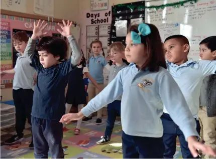  ?? PHOTOS BY TARIQ ZEHAWI/USA TODAY NETWORK ?? A kindergart­en class does yoga in Saddle Brook, N.J.